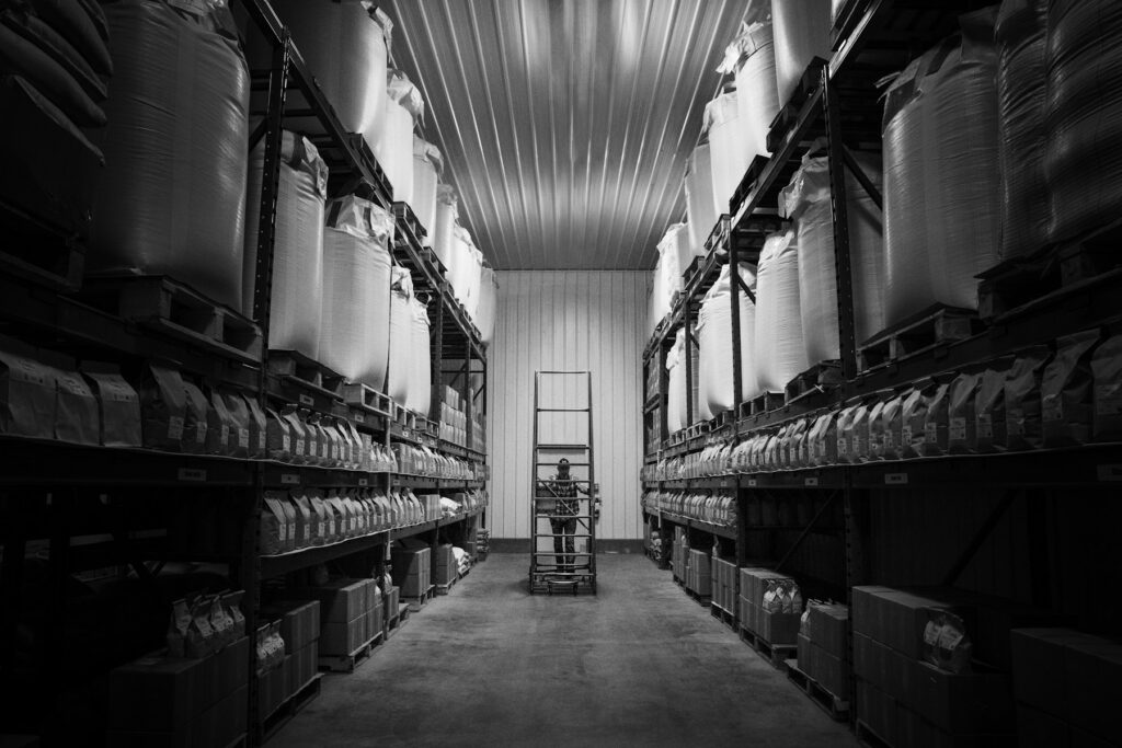 Warehouse aisles with shelves stocked with boxes